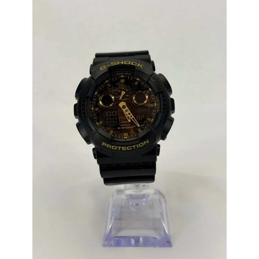 Casio G-Shock GA-100CF Black Gold Camo Dial Resin Mens Watch 5081